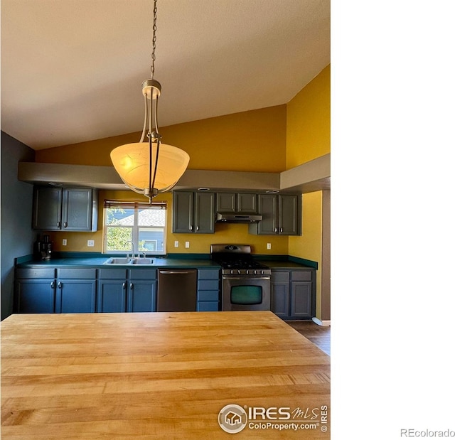 2395 Sandpiper Dr, Lafayette, CO 80026 - kitchen featuring stainless steel appliances, lofted ceiling, wooden counters, under cabinet range hood, and pendant lighting