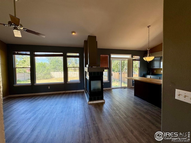 2395 Sandpiper Dr, Lafayette, CO 80026 - unfurnished living room with dark wood-type flooring, ceiling fan, and lofted ceiling