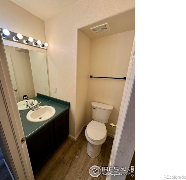 2395 Sandpiper Dr, Lafayette, CO 80026 - bathroom with wood finished floors and vanity