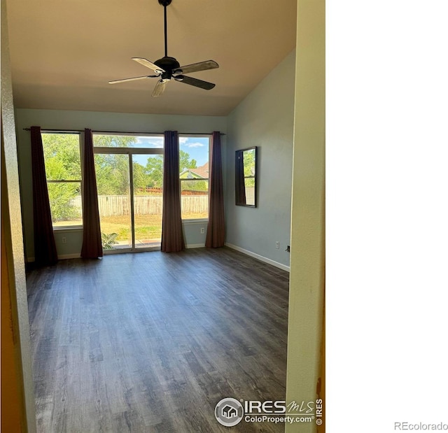 2395 Sandpiper Dr, Lafayette, CO 80026 - empty room with vaulted ceiling, dark wood-type flooring, and a ceiling fan