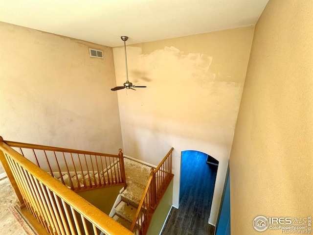 2395 Sandpiper Dr, Lafayette, CO 80026 - stairs with wood finished floors, a ceiling fan, and arched walkways