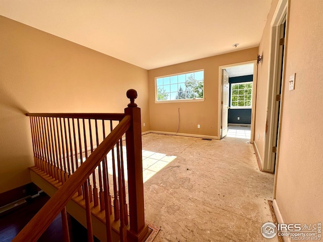 2395 Sandpiper Dr, Lafayette, CO 80026 - hallway with an upstairs landing and baseboards
