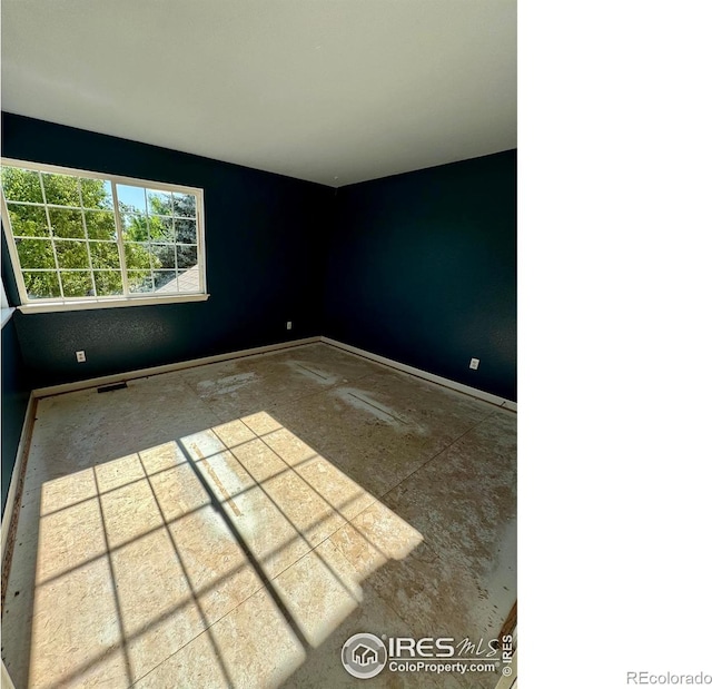 2395 Sandpiper Dr, Lafayette, CO 80026 - spare room featuring baseboards