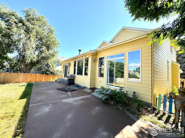 2395 Sandpiper Dr, Lafayette, CO 80026 - back of house with a patio area
