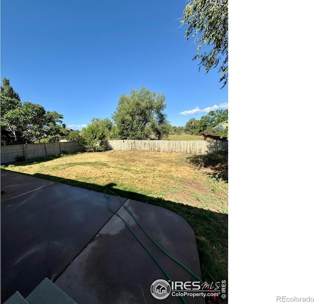 2395 Sandpiper Dr, Lafayette, CO 80026 - fenced backyard featuring a patio
