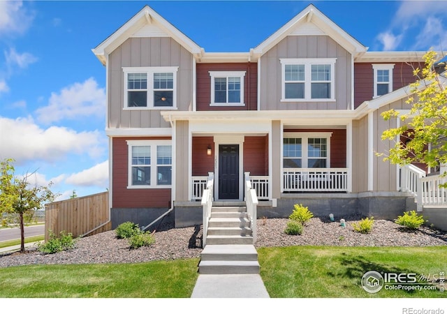 14203 Hop Clover Trl, Parker, CO 80134 - view of front of house with covered porch and board and batten siding