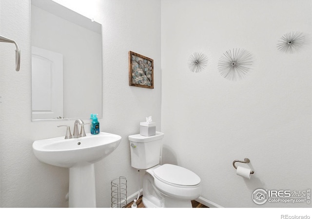 14203 Hop Clover Trl, Parker, CO 80134 - half bath with toilet and baseboards