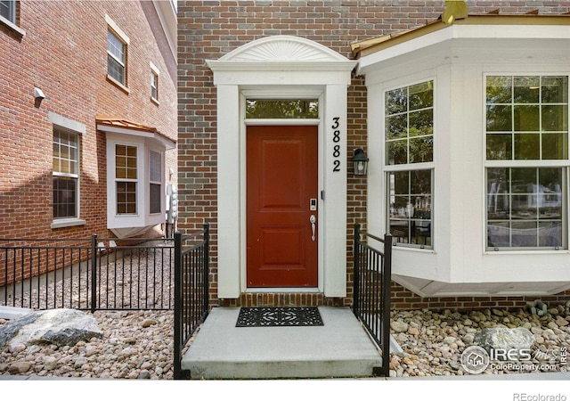 3882 W 118th Pl, Westminster, CO 80031 - doorway to property featuring brick siding
