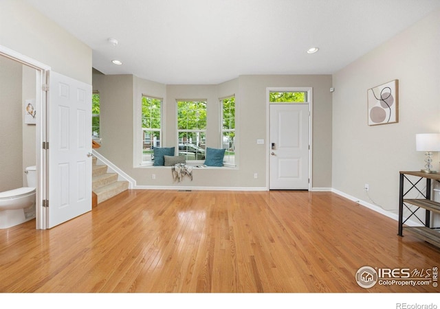 3882 W 118th Pl, Westminster, CO 80031 - entrance foyer featuring light wood finished floors, healthy amount of natural light, stairs, and recessed lighting