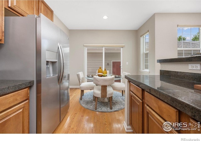 3882 W 118th Pl, Westminster, CO 80031 - kitchen featuring stainless steel refrigerator with ice dispenser, tile counters, light wood-style floors, brown cabinetry, and recessed lighting