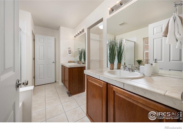 3882 W 118th Pl, Westminster, CO 80031 - bathroom featuring a shower with door, tile patterned floors, and two vanities