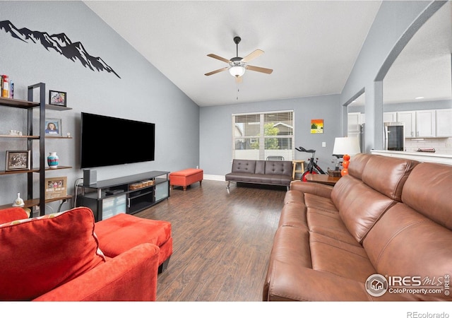 2302 74th Ave, Greeley, CO 80634 - living area featuring lofted ceiling, a ceiling fan, dark wood finished floors, and arched walkways