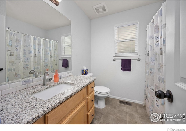 2302 74th Ave, Greeley, CO 80634 - full bathroom featuring vanity and toilet