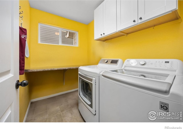 2302 74th Ave, Greeley, CO 80634 - laundry area featuring cabinet space and independent washer and dryer