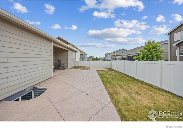 2302 74th Ave, Greeley, CO 80634 - fenced backyard with a patio area