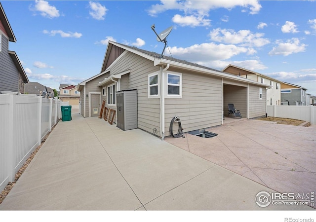 2302 74th Ave, Greeley, CO 80634 - back of property with a patio area and a fenced backyard
