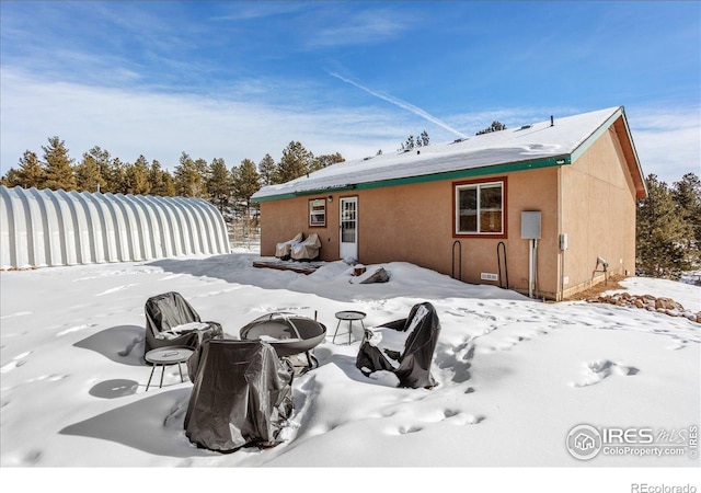3367 Badger Creek Rd, Hartsel, CO 80449 - snow covered property featuring a fire pit and stucco siding