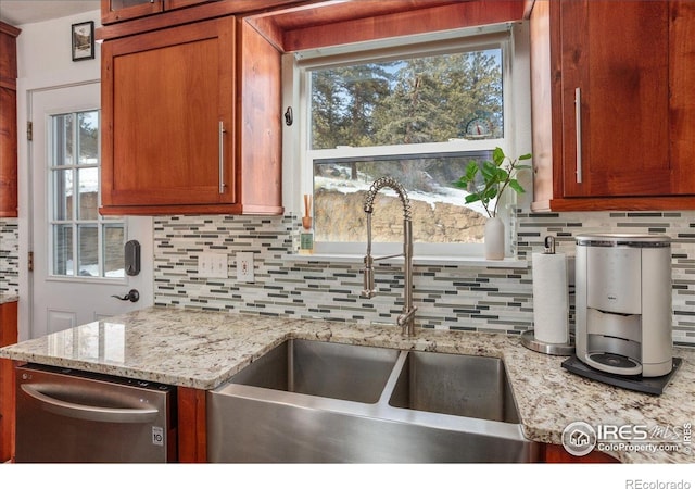 3367 Badger Creek Rd, Hartsel, CO 80449 - kitchen featuring stainless steel dishwasher, tasteful backsplash, and brown cabinetry