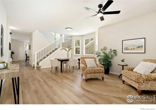 2262 Harvest St, Fort Collins, CO 80528 - sitting room with stairway, light wood-type flooring, and a ceiling fan