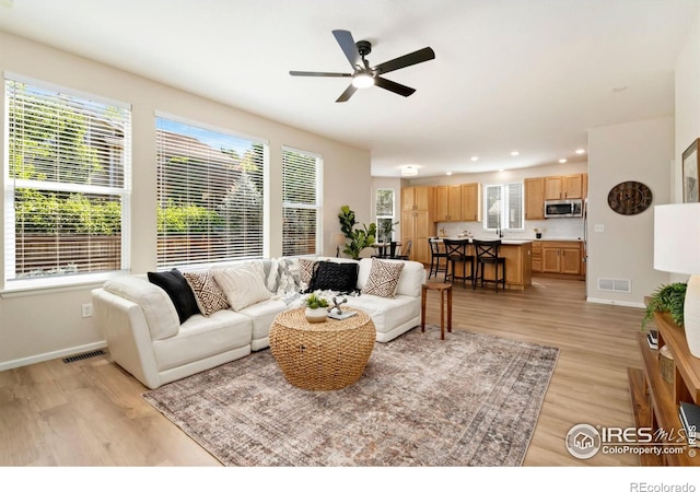 2262 Harvest St, Fort Collins, CO 80528 - living area featuring light wood-type flooring, ceiling fan, and recessed lighting
