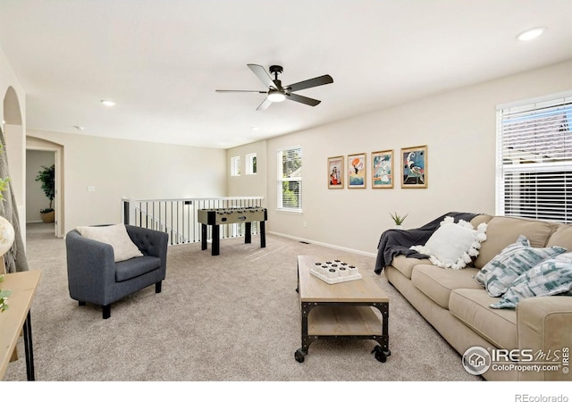 2262 Harvest St, Fort Collins, CO 80528 - carpeted living area featuring a ceiling fan, recessed lighting, and arched walkways