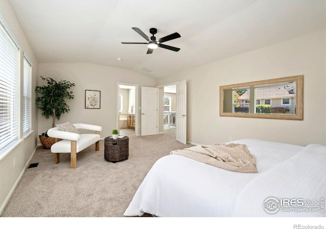 2262 Harvest St, Fort Collins, CO 80528 - carpeted bedroom with multiple windows, vaulted ceiling, ceiling fan, and ensuite bath