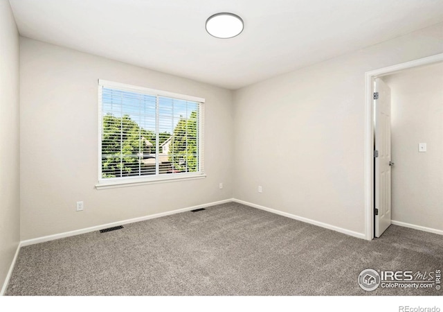 2262 Harvest St, Fort Collins, CO 80528 - carpeted spare room featuring baseboards