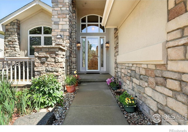 1145 Wyndemere Cir, Longmont, CO 80504 - property entrance with stone siding and stucco siding