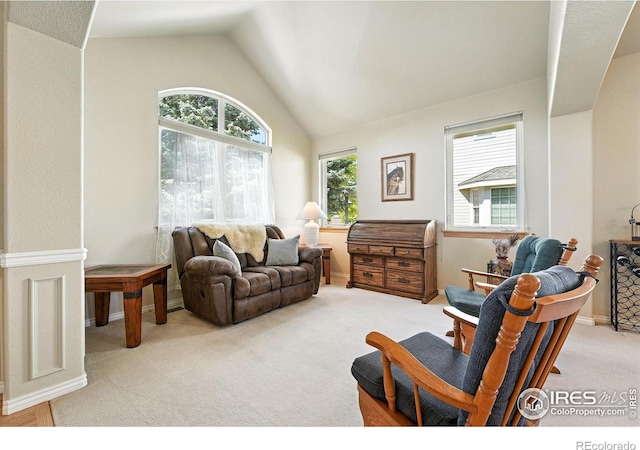 1145 Wyndemere Cir, Longmont, CO 80504 - carpeted living area with vaulted ceiling and baseboards