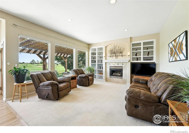 1145 Wyndemere Cir, Longmont, CO 80504 - living room with a fireplace, built in features, and recessed lighting