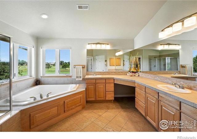 1145 Wyndemere Cir, Longmont, CO 80504 - full bathroom featuring double vanity, a stall shower, a bath, tile patterned floors, and recessed lighting