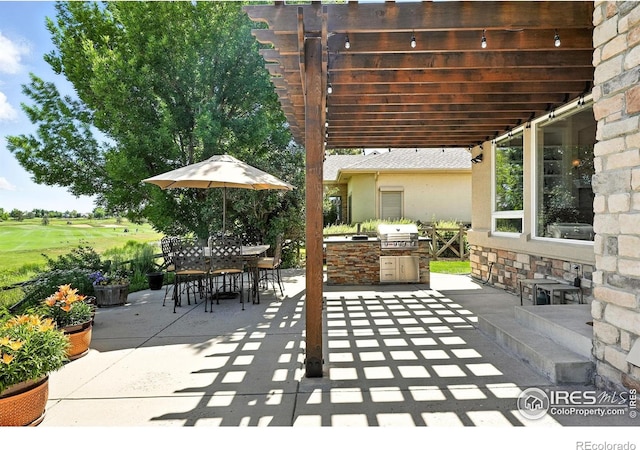 1145 Wyndemere Cir, Longmont, CO 80504 - view of patio / terrace with area for grilling, outdoor dining area, and view of golf course