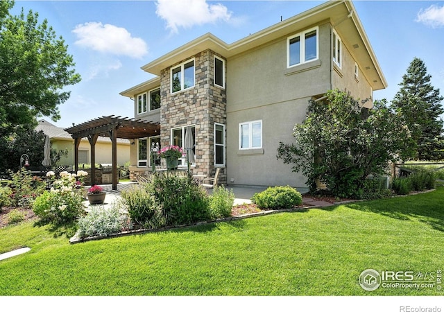 1145 Wyndemere Cir, Longmont, CO 80504 - rear view of property with a pergola, a patio area, stucco siding, a lawn, and stone siding
