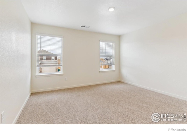 9929 Ceylon Ct, Commerce City, CO 80022 - carpeted spare room featuring baseboards