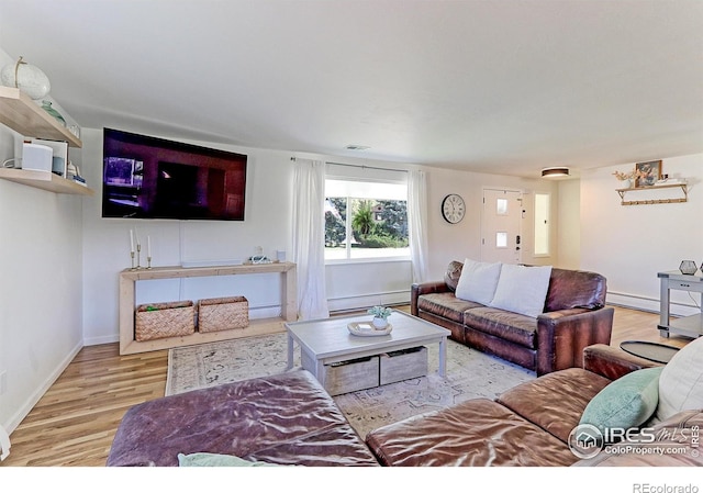 11230 W 77th Dr, Arvada, CO 80005 - living area featuring wood finished floors and baseboard heating