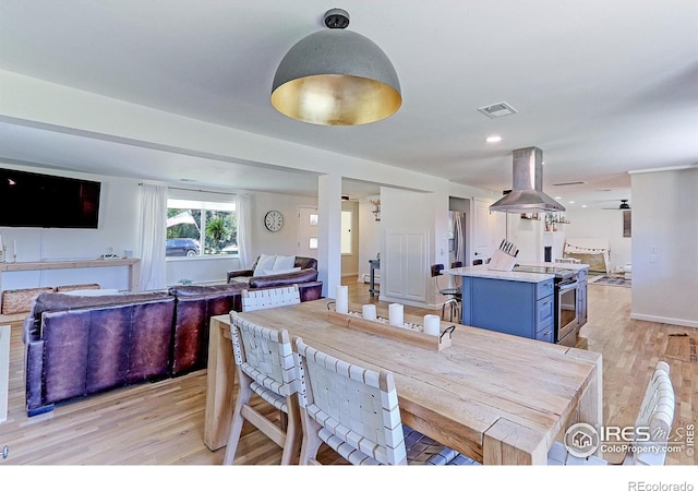 11230 W 77th Dr, Arvada, CO 80005 - dining space featuring light wood-type flooring and baseboards