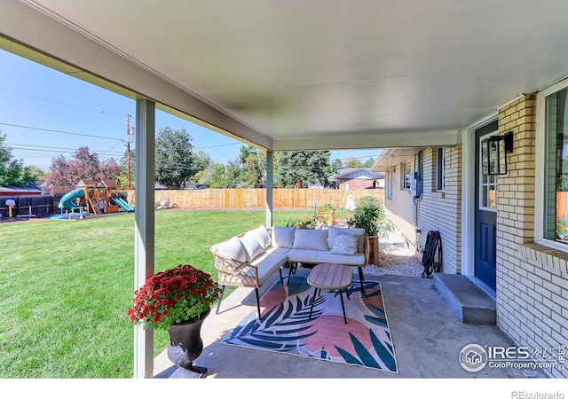 11230 W 77th Dr, Arvada, CO 80005 - fenced backyard with a playground, outdoor lounge area, and a patio area