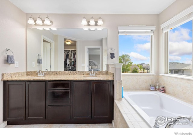 1705 Wales Dr, Berthoud, CO 80513 - full bath with a bath, double vanity, and a walk in closet