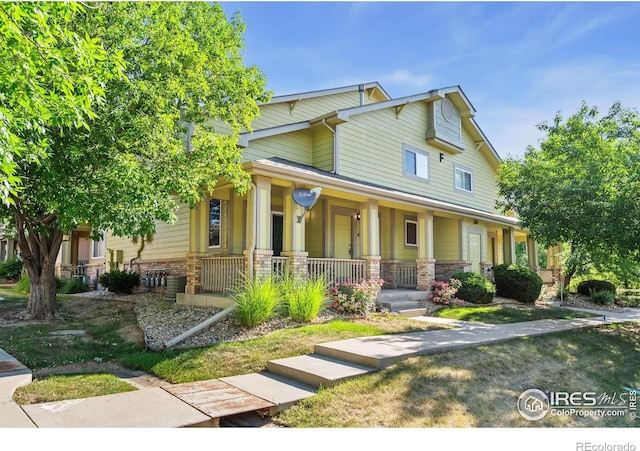 2702 Rigden Pkwy Unit F4, Fort Collins, CO 80525 - view of front of home with covered porch and brick siding