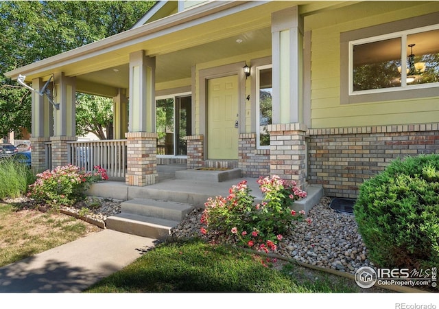2702 Rigden Pkwy Unit F4, Fort Collins, CO 80525 - entrance to property with covered porch and brick siding