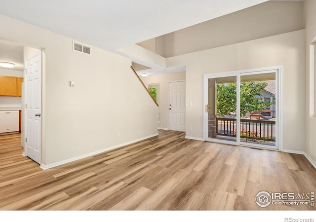 2702 Rigden Pkwy Unit F4, Fort Collins, CO 80525 - unfurnished living room with light wood finished floors and baseboards