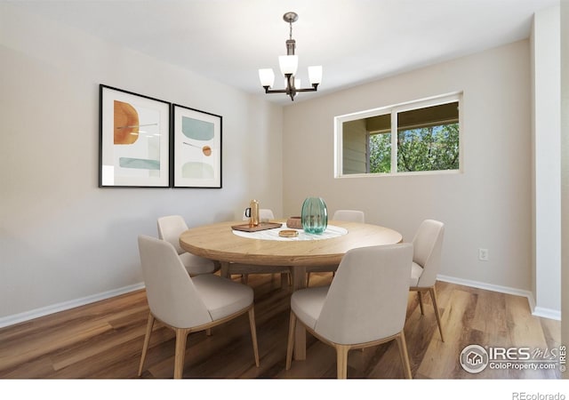 2702 Rigden Pkwy Unit F4, Fort Collins, CO 80525 - dining area with light wood-type flooring and a chandelier
