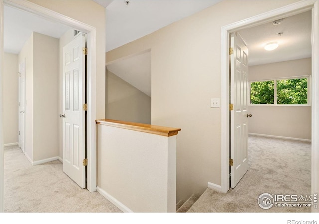 2702 Rigden Pkwy Unit F4, Fort Collins, CO 80525 - hall with carpet flooring and an upstairs landing