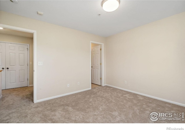 2702 Rigden Pkwy Unit F4, Fort Collins, CO 80525 - empty room featuring carpet flooring and a pendent fire sprinkler