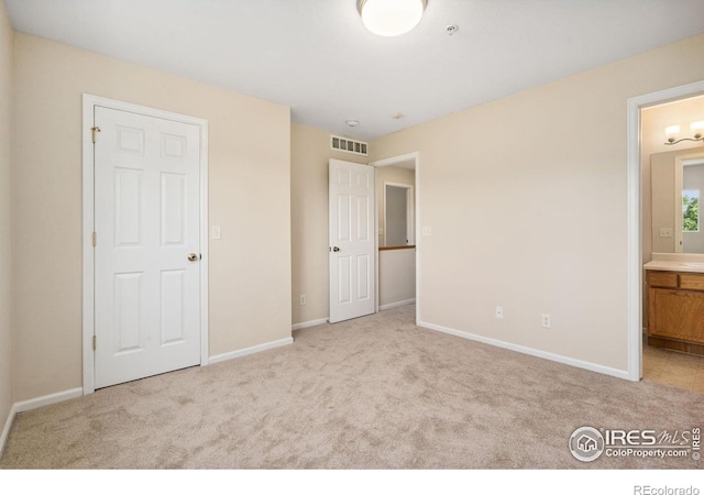 2702 Rigden Pkwy Unit F4, Fort Collins, CO 80525 - unfurnished bedroom with carpet floors and connected bathroom