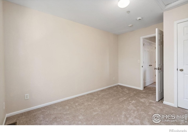 2702 Rigden Pkwy Unit F4, Fort Collins, CO 80525 - carpeted spare room featuring a smoke detector and attic access