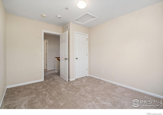 2702 Rigden Pkwy Unit F4, Fort Collins, CO 80525 - unfurnished bedroom with attic access and carpet floors