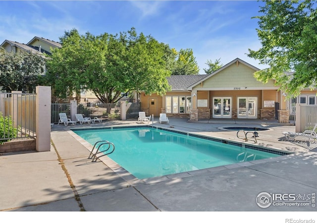 2702 Rigden Pkwy Unit F4, Fort Collins, CO 80525 - community pool with french doors and a patio area