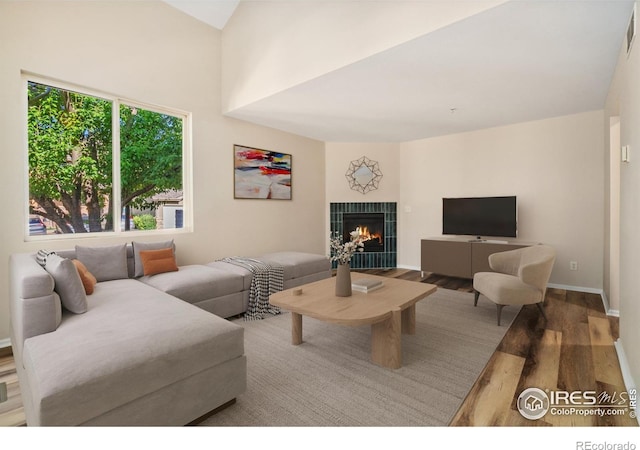2702 Rigden Pkwy Unit F4, Fort Collins, CO 80525 - living room featuring wood finished floors and a fireplace