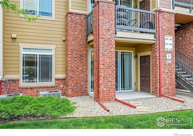 2133 Krisron Rd Unit D103, Fort Collins, CO 80525 - doorway to property with a balcony and brick siding